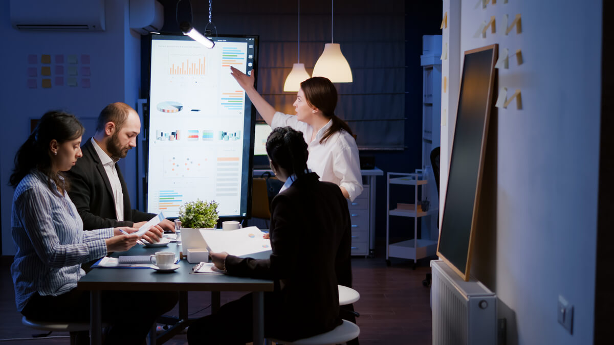 Project managers discussing stats